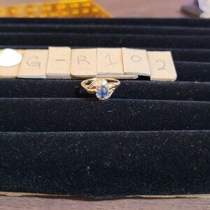 Item # GR102  14K Gold Blue center stone tiny diamonds ring size 5